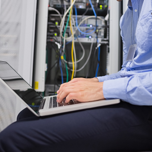 man programming on laptop