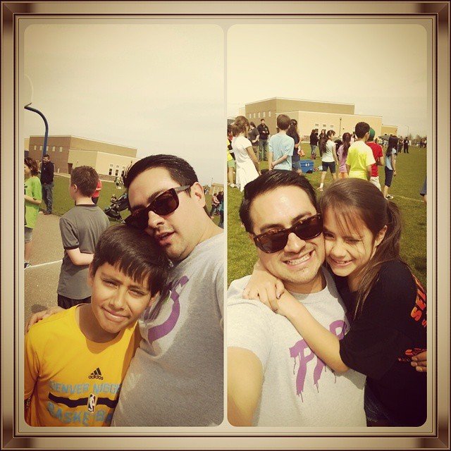 man taking photos with children