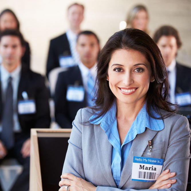 woman standing in front of her team