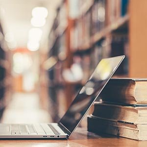 laptop and books
