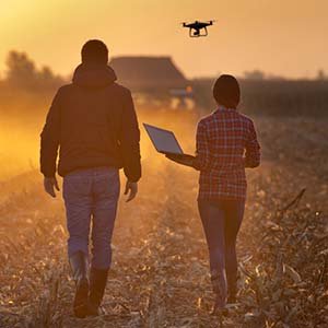 man and woman raising a drone