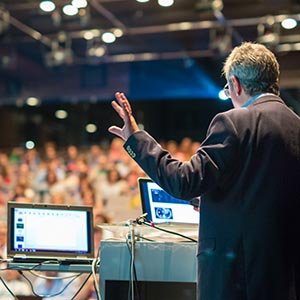 successful professionals speaking to the public