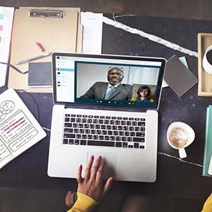 person having a video call on her laptop